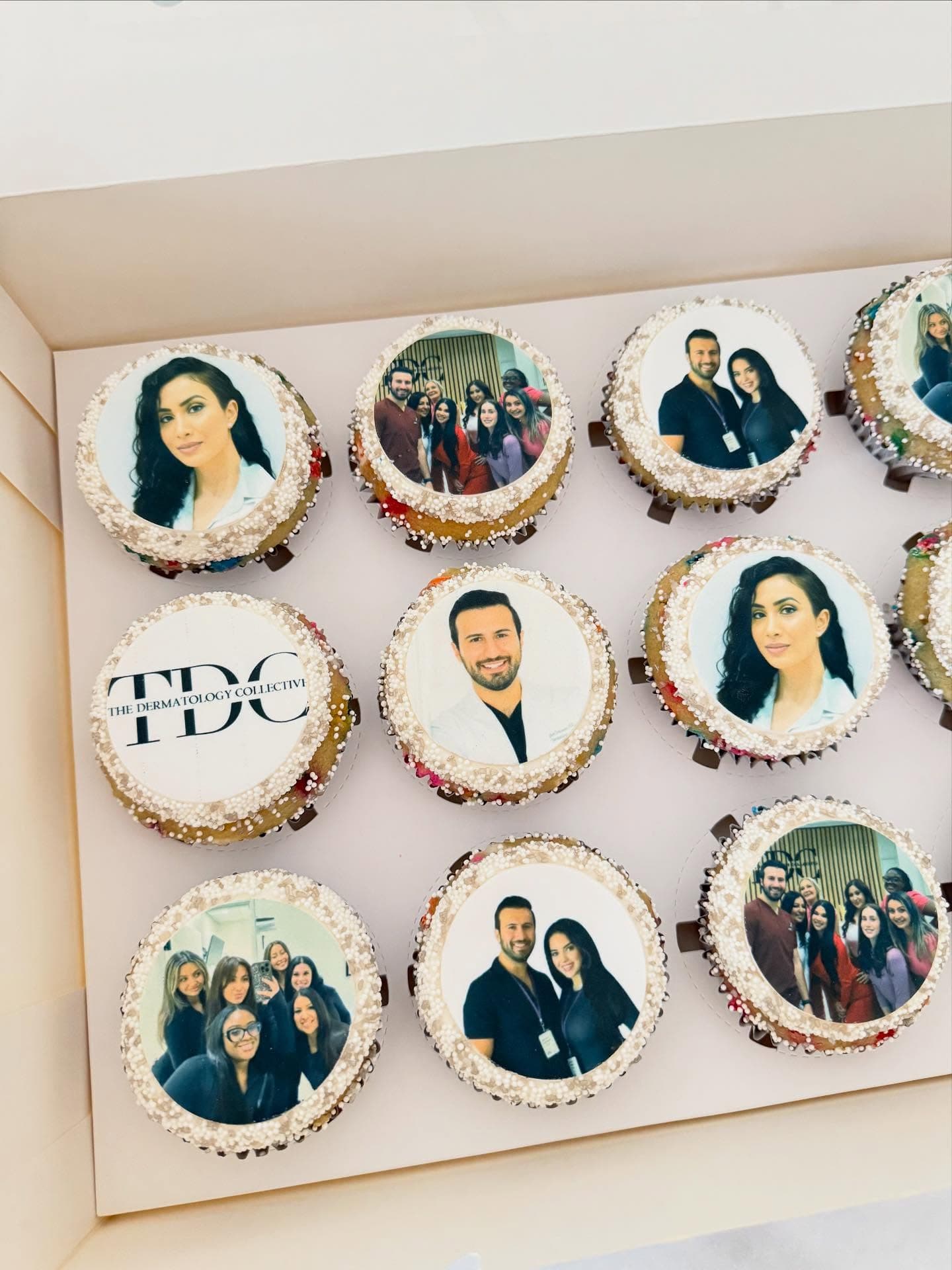 Cupcakes topped with edible-printed team photos for The Dermatology Collective